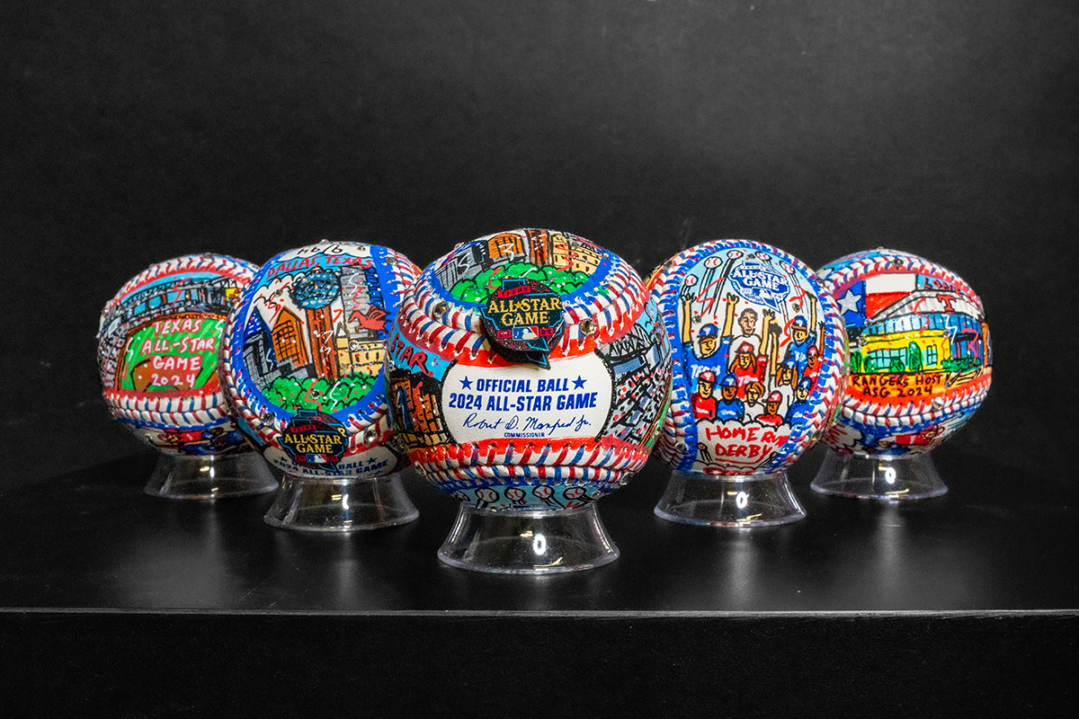 A row of 5 hand-painted baseballs for the MLB 2024 All-Star game