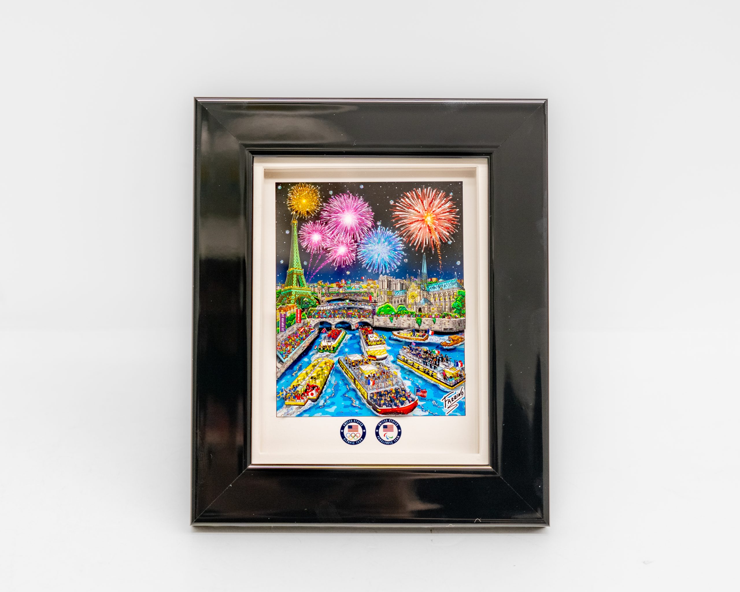 A mini print with fireworks surrounded by a circle of trees over a colorful Paris cityscape including boats on the river and the Olympic stadium