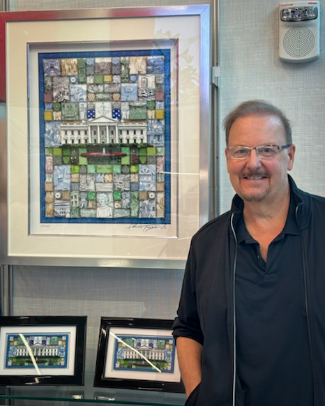 Fazzino at the gift shop of The People's House with his artwork and mini print in display cases behind him