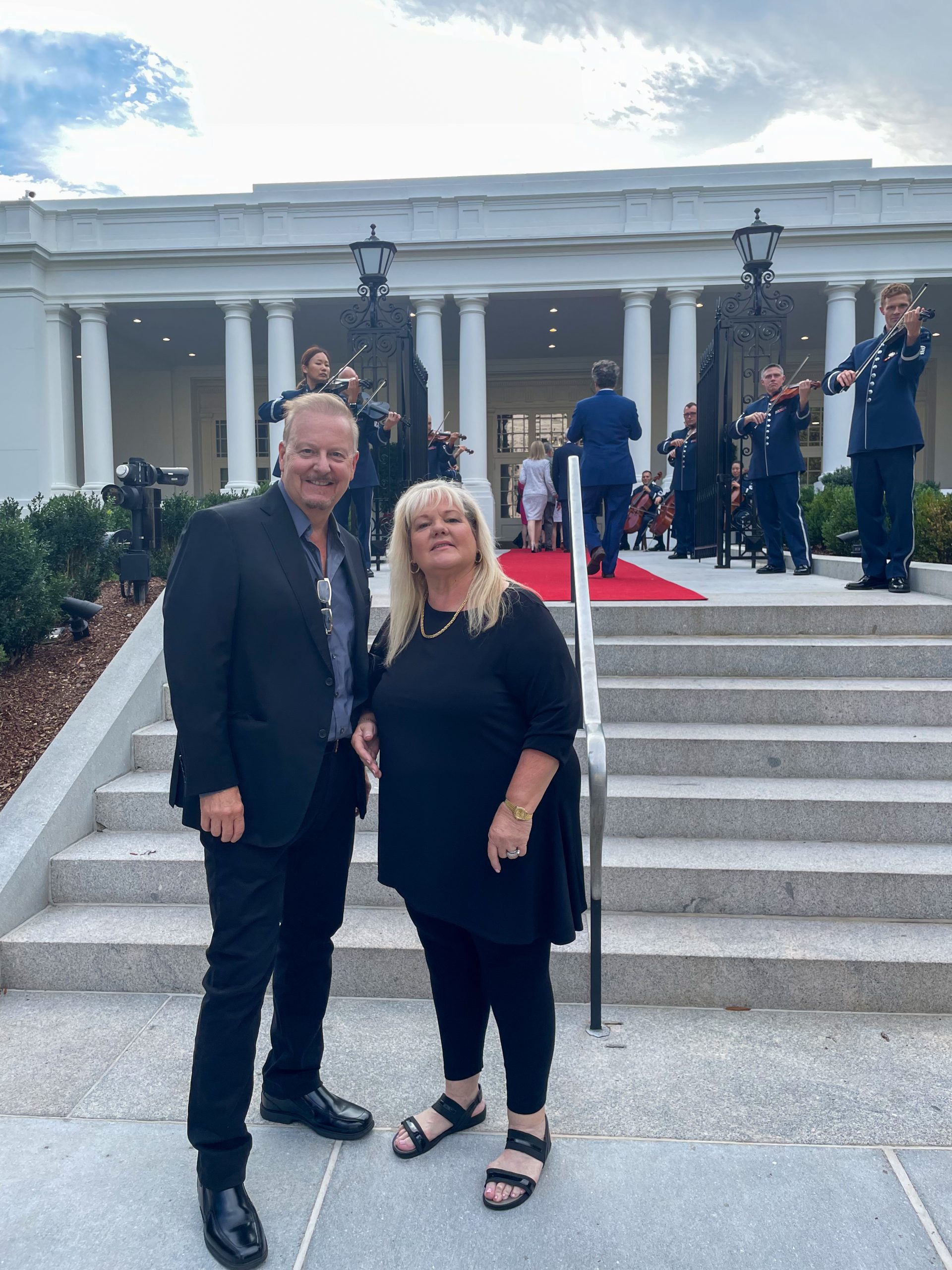 Fazzino and his wife stand side-by-side in front of The People's Place museum in Washington DC