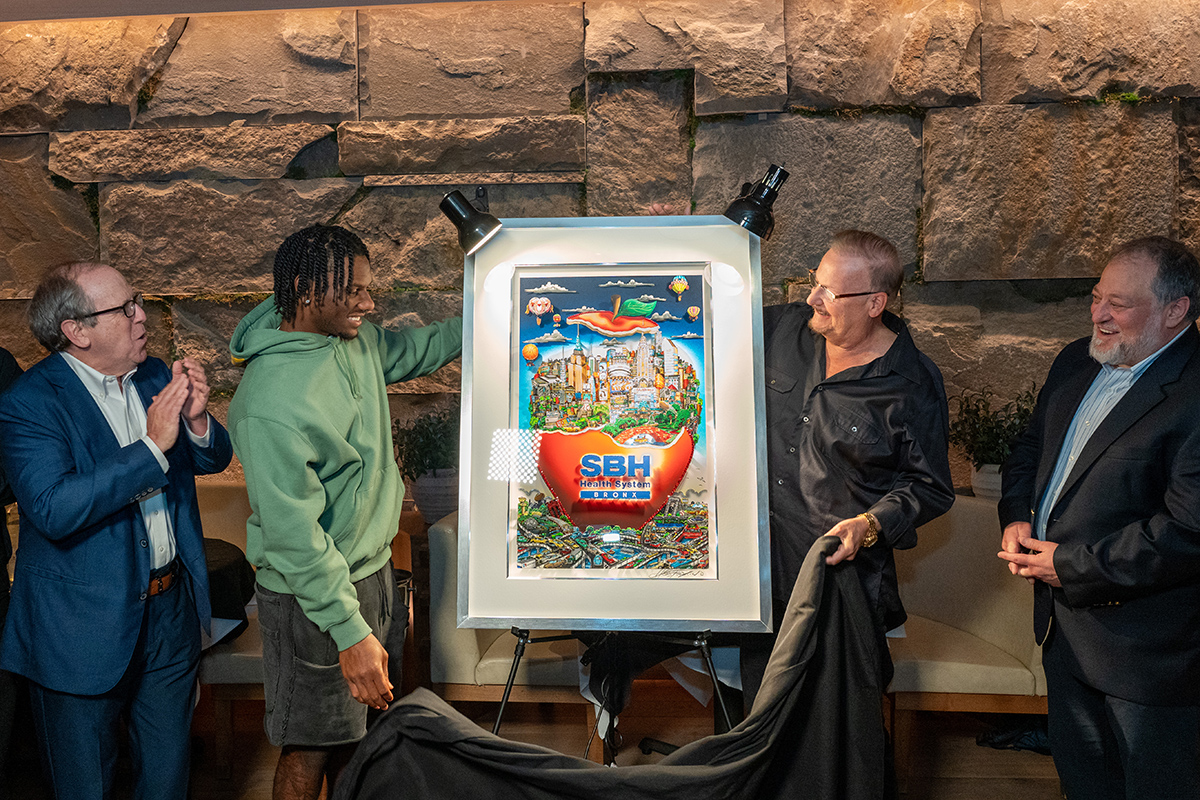 NY Giants WR Malik Nabers and Fazzino unveil the artwork for SBY while the SBH CEO and NY Islanders owner look on smiling and clapping