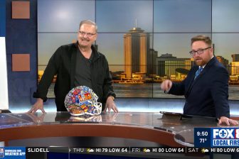 Fazzino stands across from Rob Krieger on Fox New 8 in New Orleans to talk about his Super Bowl including the hand-painted helmets that started it all